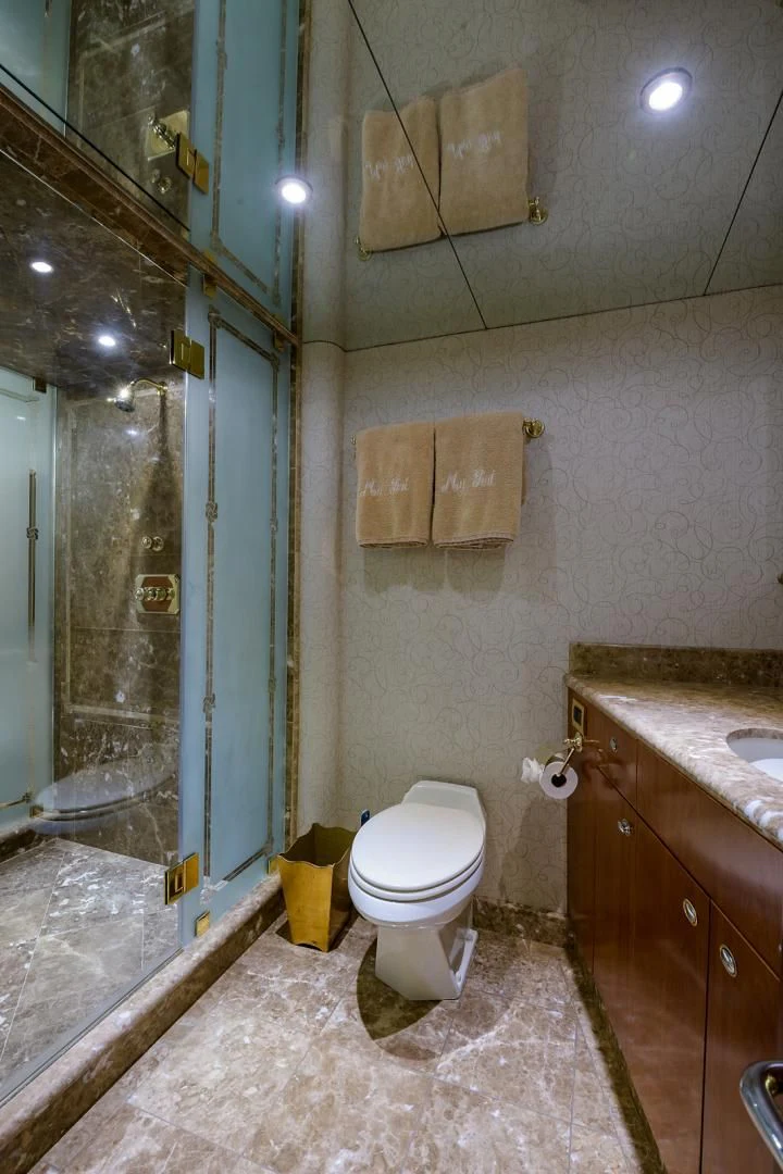 a bathroom with a toilet and a sink aboard MY GIRL Yacht for Sale