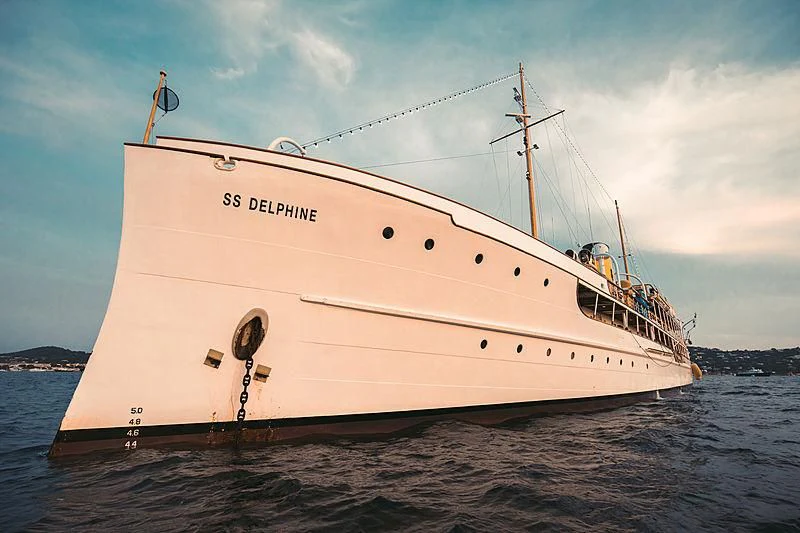 a large white ship in the water aboard SS DELPHINE Yacht for Sale