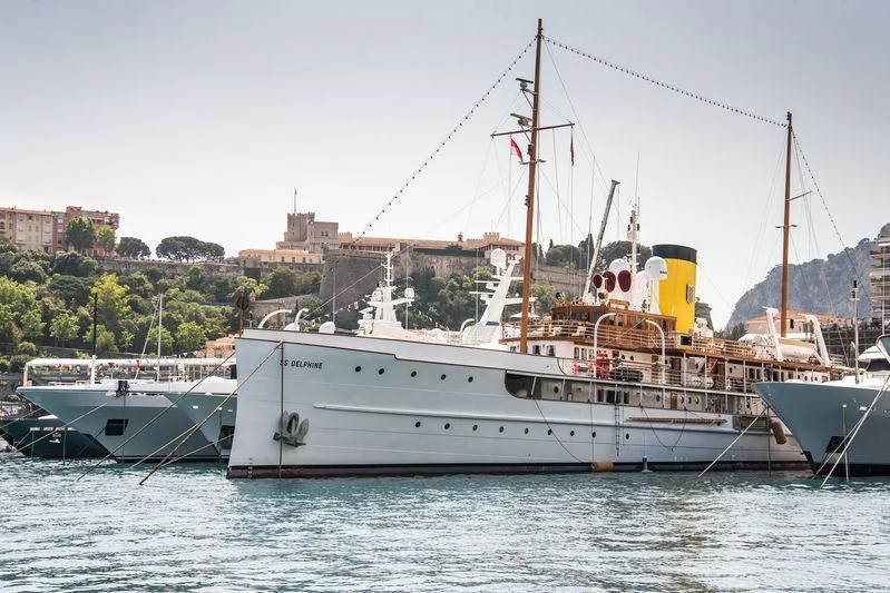a large white boat sits in the water aboard SS DELPHINE Yacht for Sale