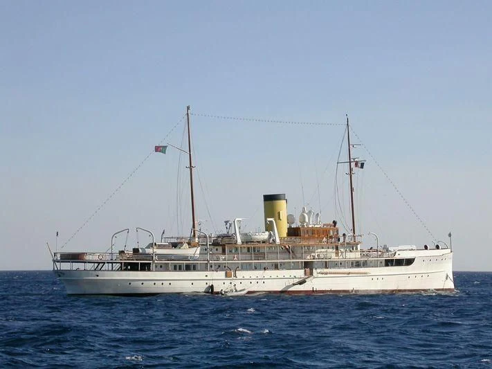 a large white boat in the water aboard SS DELPHINE Yacht for Sale