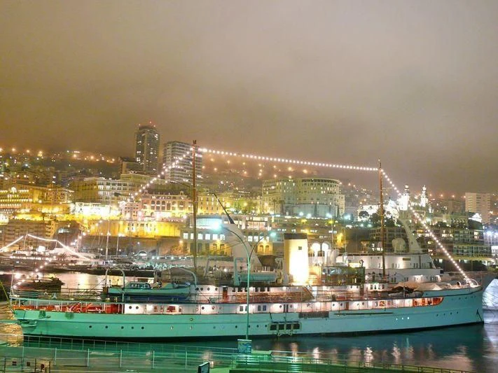 a large boat in a harbor aboard SS DELPHINE Yacht for Sale