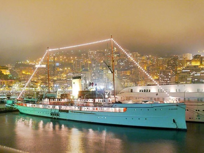 a large boat in front of a bridge aboard SS DELPHINE Yacht for Sale