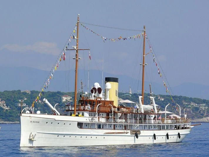 a boat with a sail on the water aboard SS DELPHINE Yacht for Sale