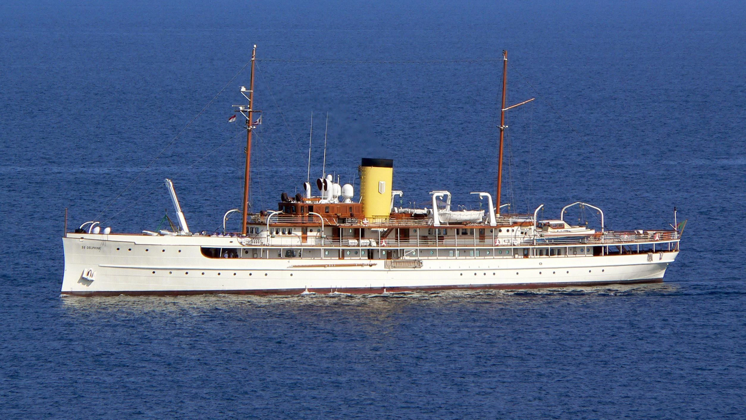 a large white ship in the water aboard SS DELPHINE Yacht for Sale