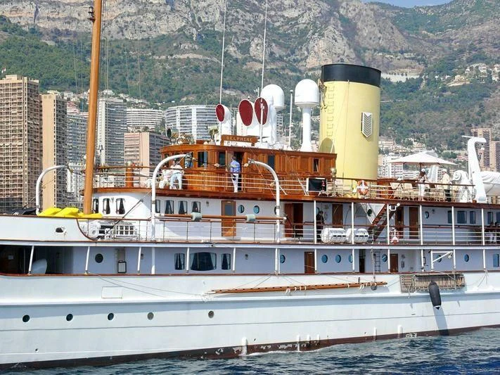 a large white boat with a yellow tower on the front aboard SS DELPHINE Yacht for Sale