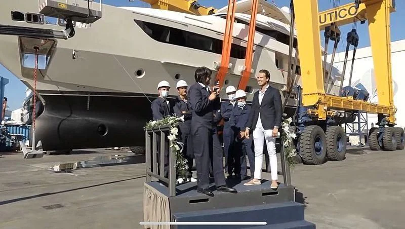 a group of men standing next to a military plane aboard DARYA Yacht for Sale