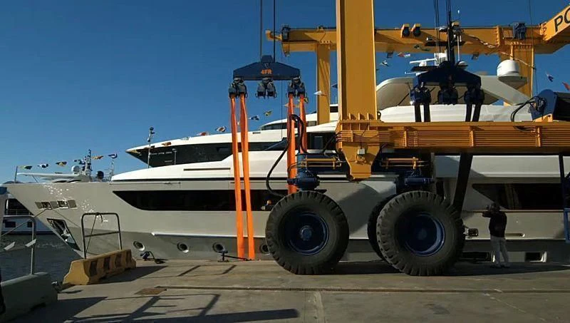 a large white boat with a large orange crane on the deck aboard DARYA Yacht for Sale