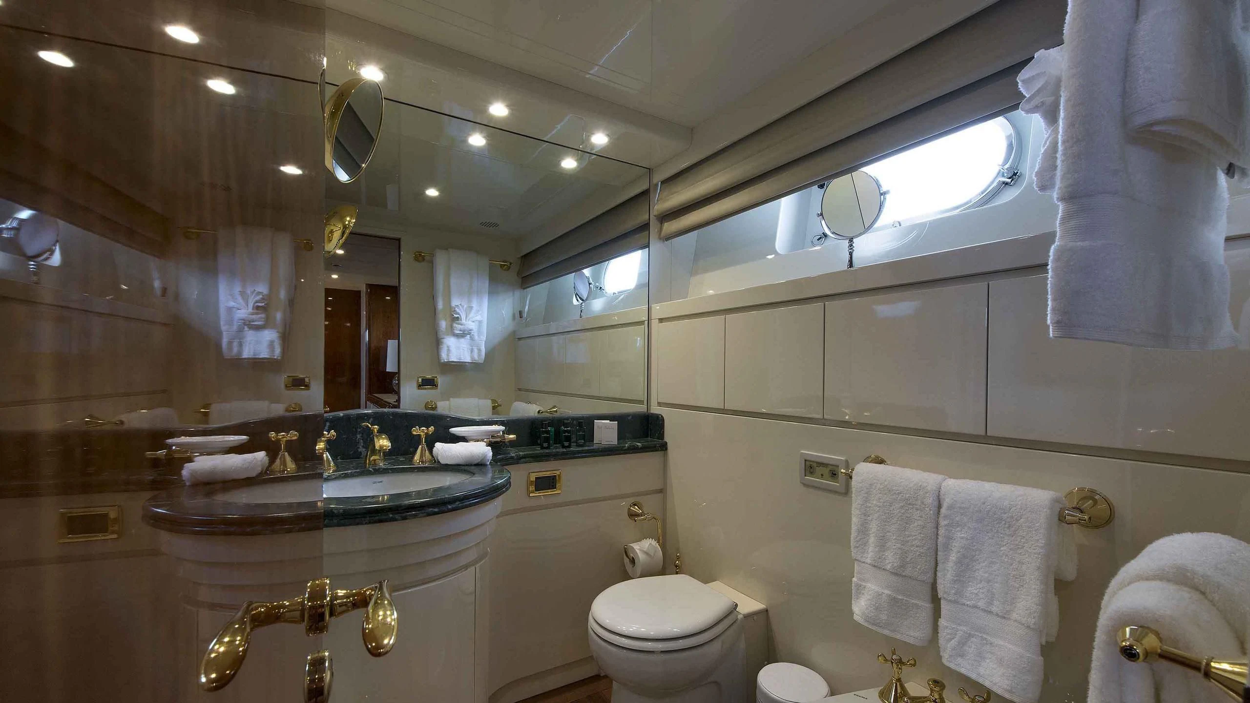 a bathroom with a large mirror aboard LUMINOUS Yacht for Sale