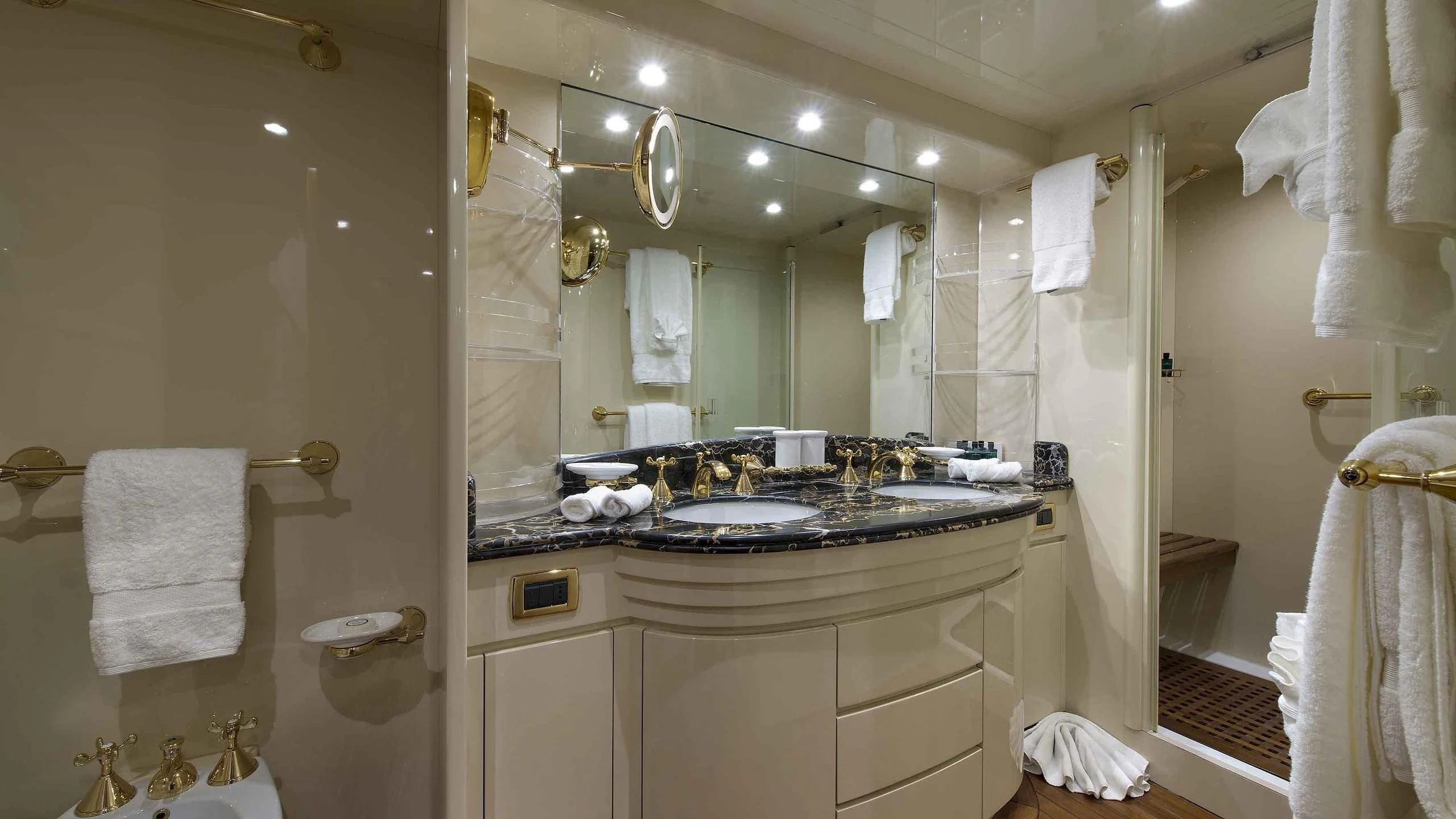 a bathroom with a large mirror aboard LUMINOUS Yacht for Sale