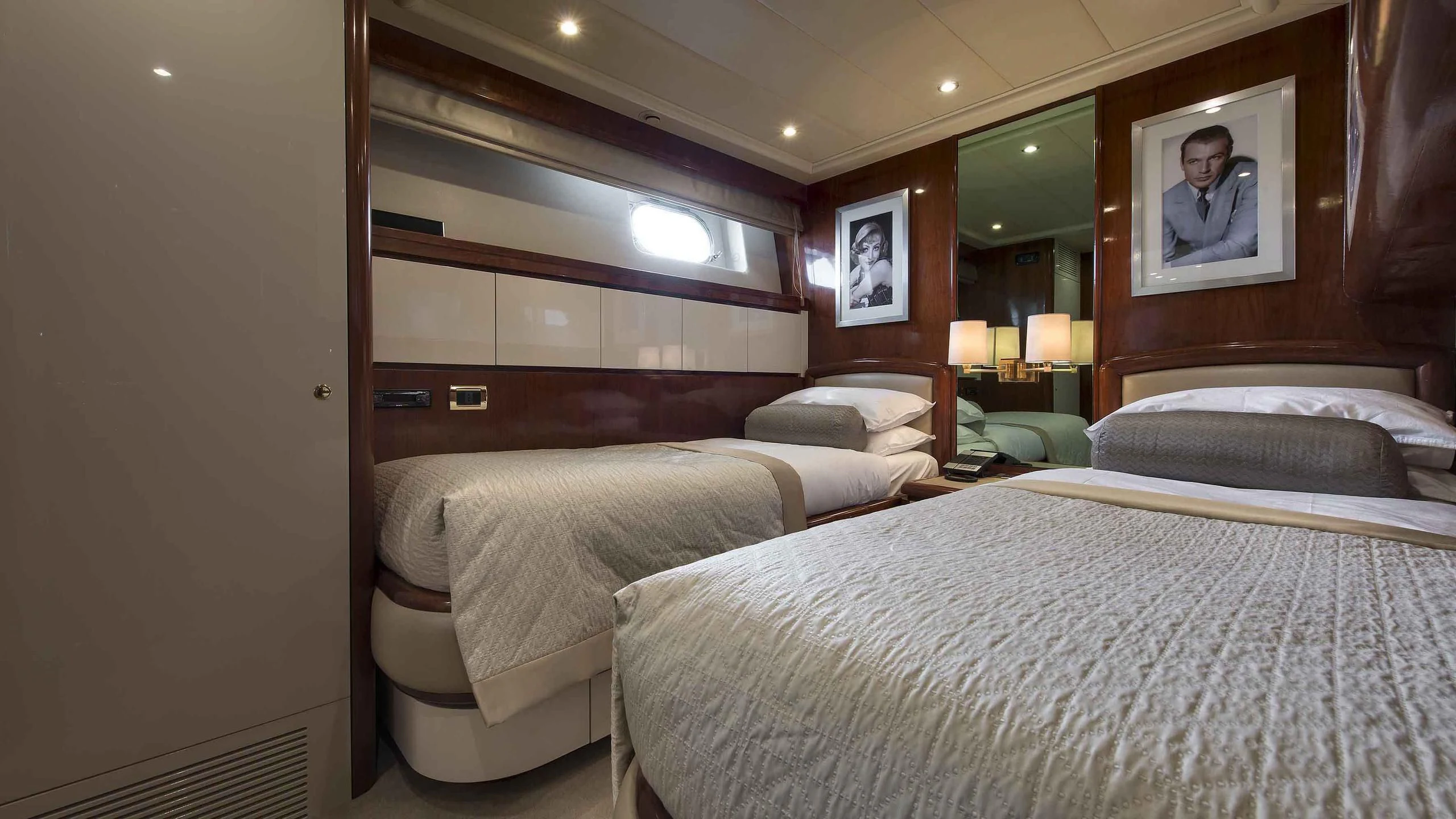 a hotel room with two beds aboard LUMINOUS Yacht for Sale