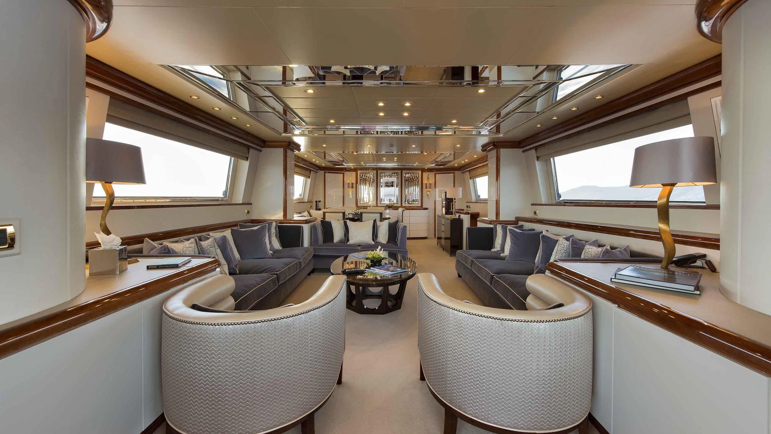 a room with a bed and a desk aboard LUMINOUS Yacht for Sale