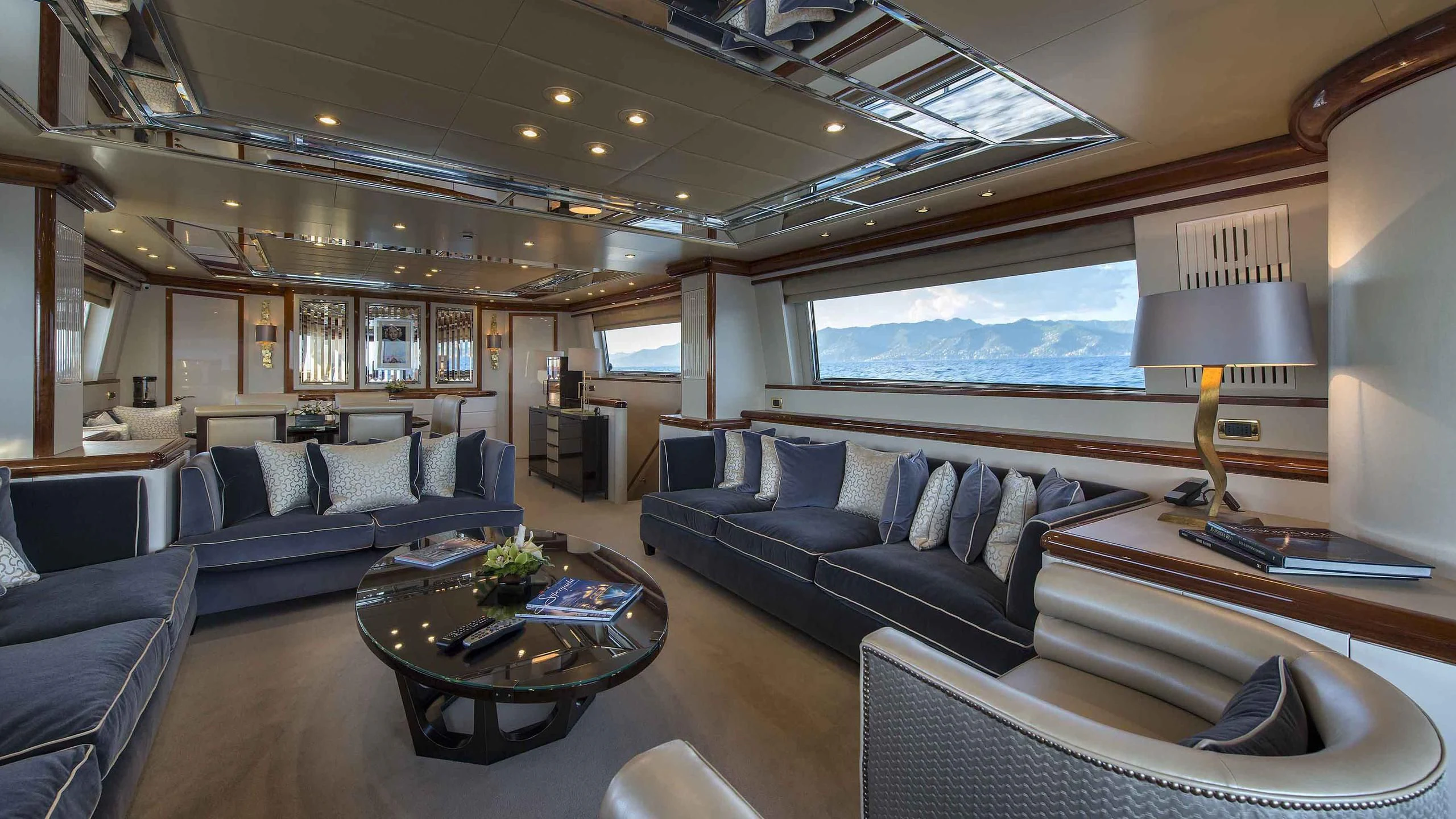 a living room with a large window aboard LUMINOUS Yacht for Sale