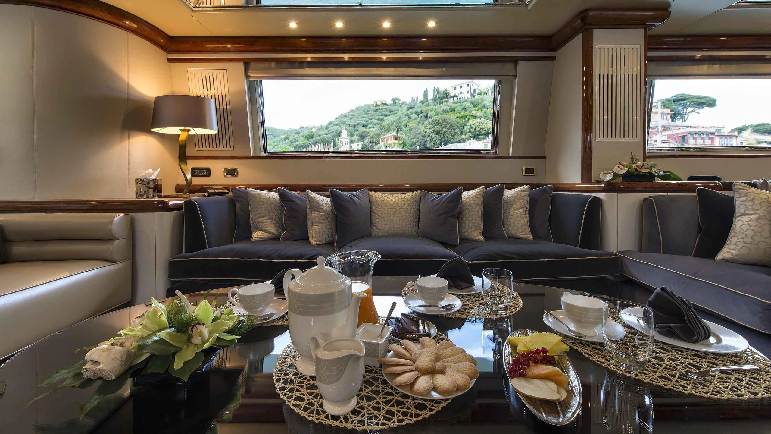 a living room with a large window aboard LUMINOUS Yacht for Sale