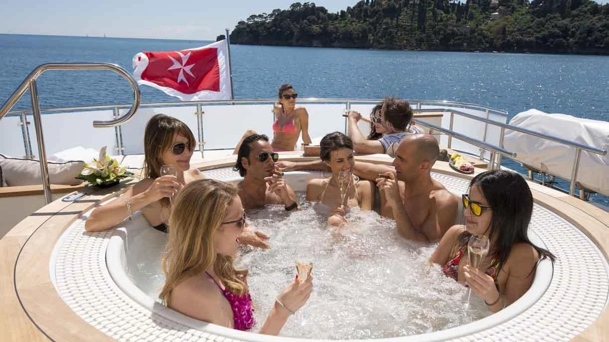 a group of people in a pool aboard LUMINOUS Yacht for Sale