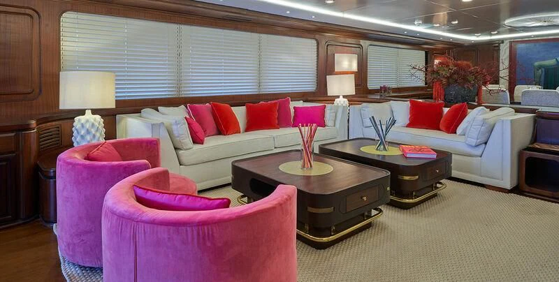 a living room with a couch and a coffee table aboard DENEB'S DAUGHTERS Yacht for Sale