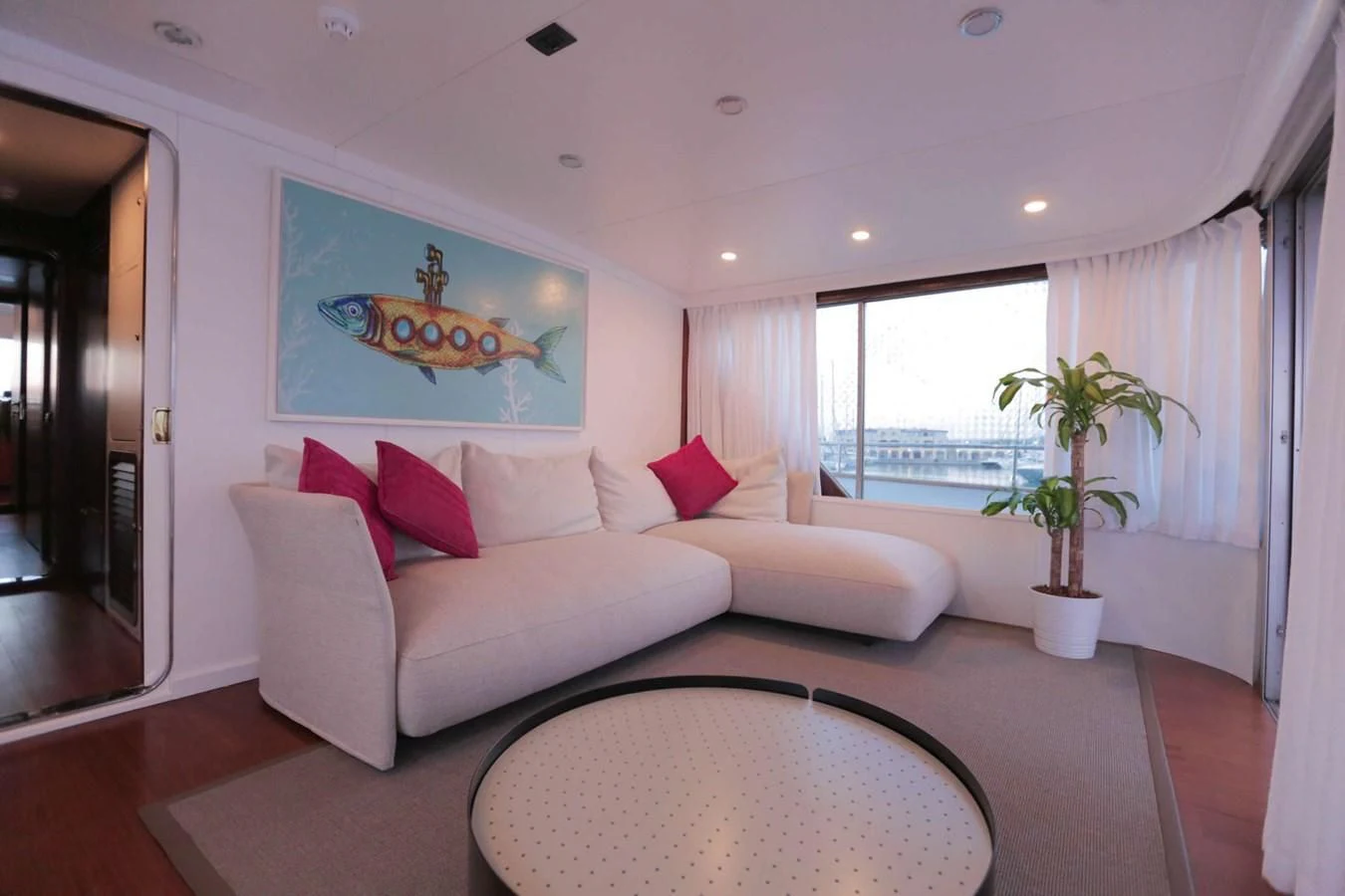 a living room with a couch and a table aboard DENEB'S DAUGHTERS Yacht for Sale