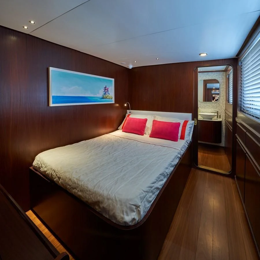 a bed in a room aboard DENEB'S DAUGHTERS Yacht for Sale