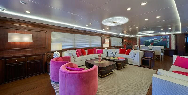 a large room with a couch and a table aboard DENEB'S DAUGHTERS Yacht for Sale