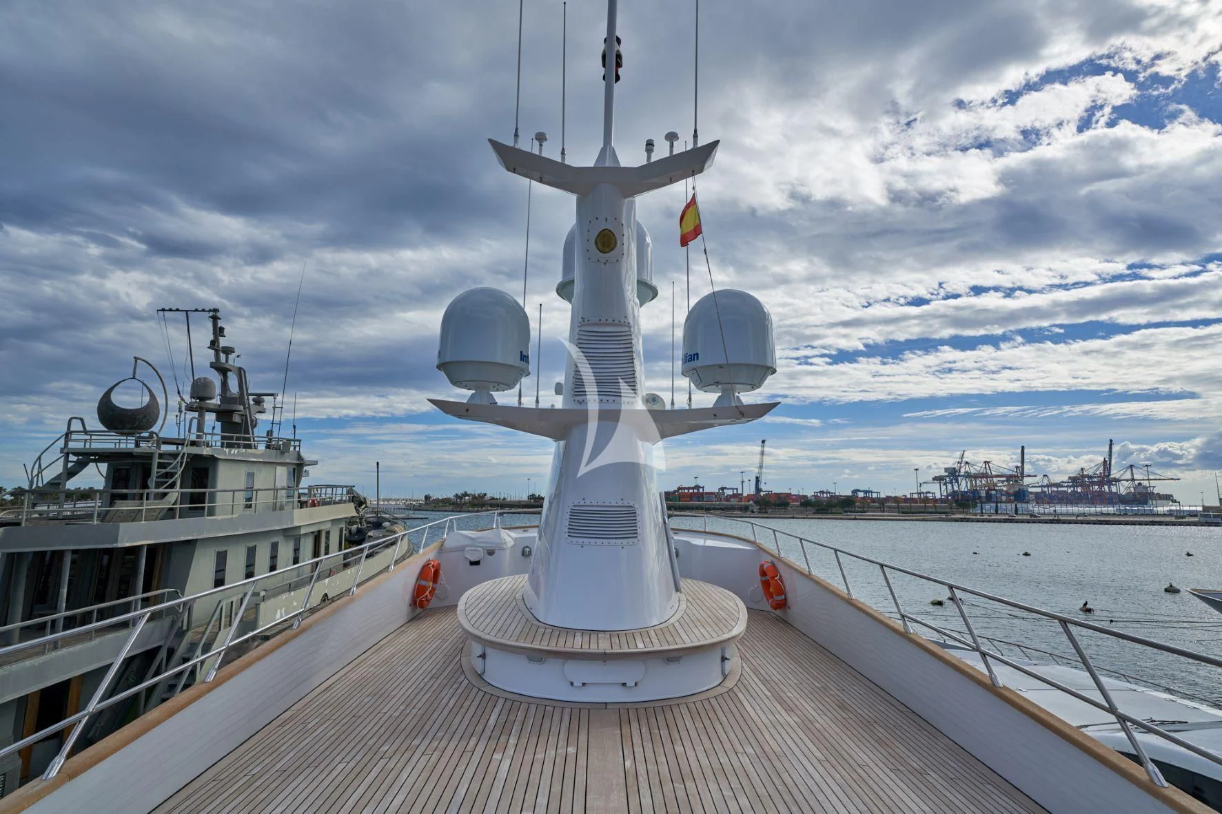 a large metal ship on a dock aboard DENEB'S DAUGHTERS Yacht for Sale