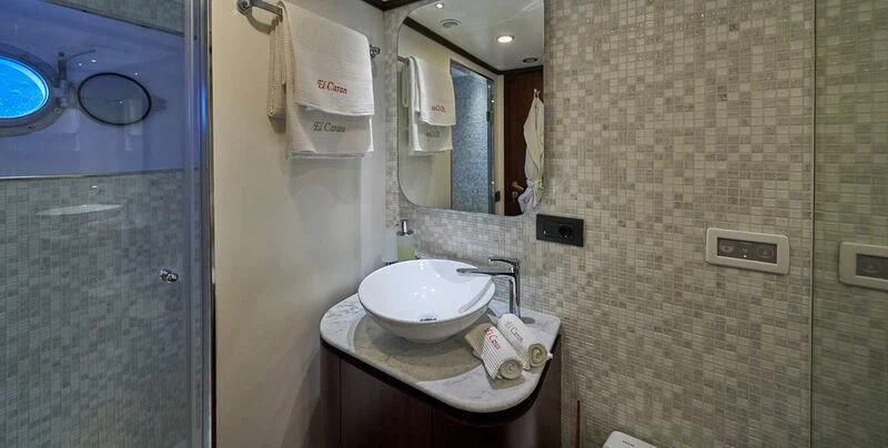 a bathroom with a sink and a mirror aboard DENEB'S DAUGHTERS Yacht for Sale
