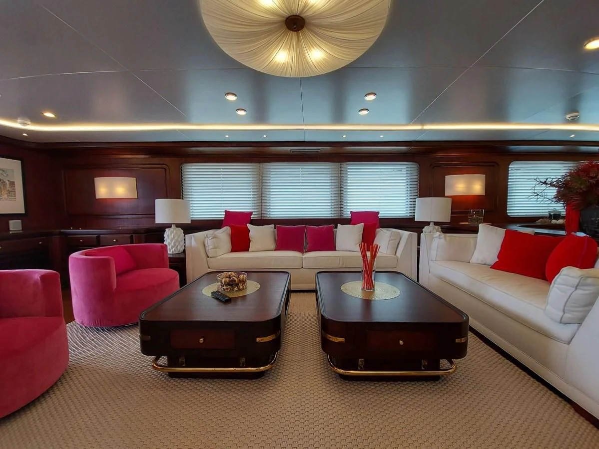 a living room with a couch and a table aboard DENEB'S DAUGHTERS Yacht for Sale