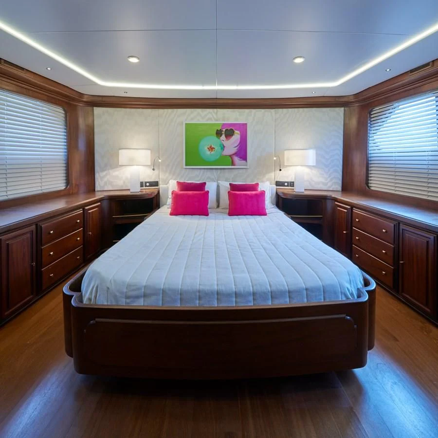 a large bed in a room aboard DENEB'S DAUGHTERS Yacht for Sale