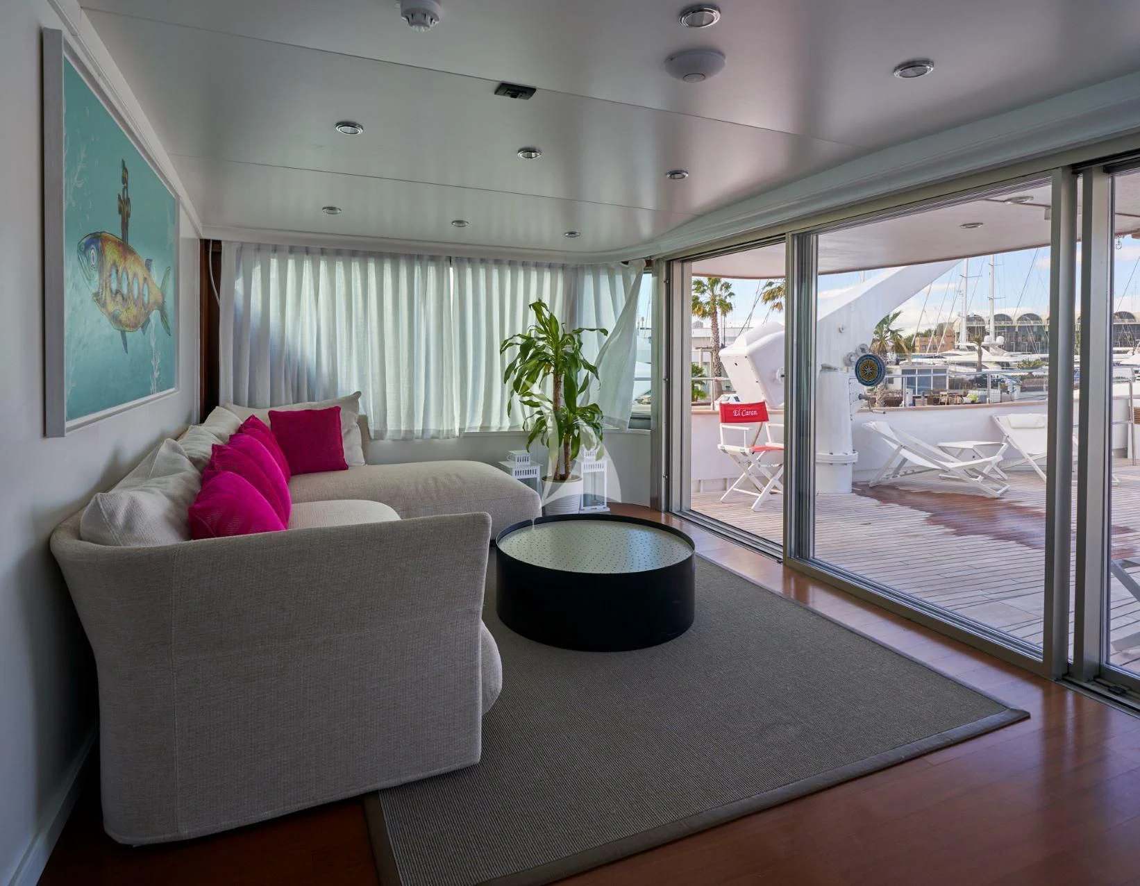 a living room with a large window aboard DENEB'S DAUGHTERS Yacht for Sale