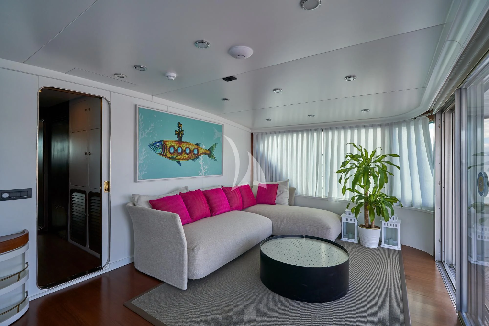 a living room with a couch and a table aboard DENEB'S DAUGHTERS Yacht for Sale