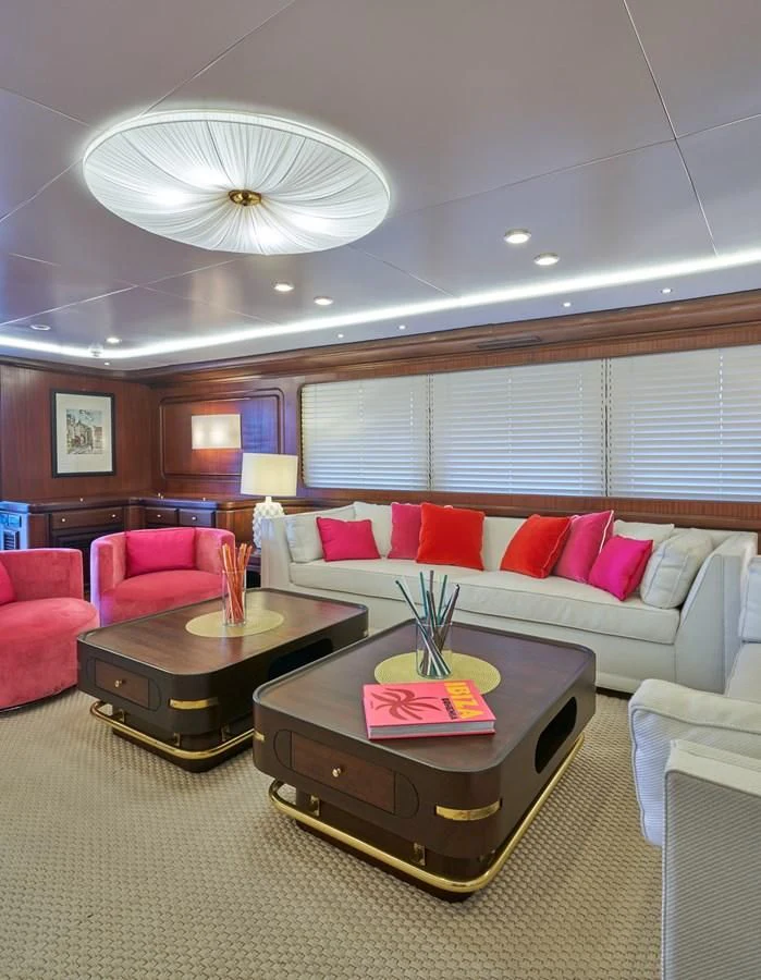 a living room with a couch and a table aboard DENEB'S DAUGHTERS Yacht for Sale