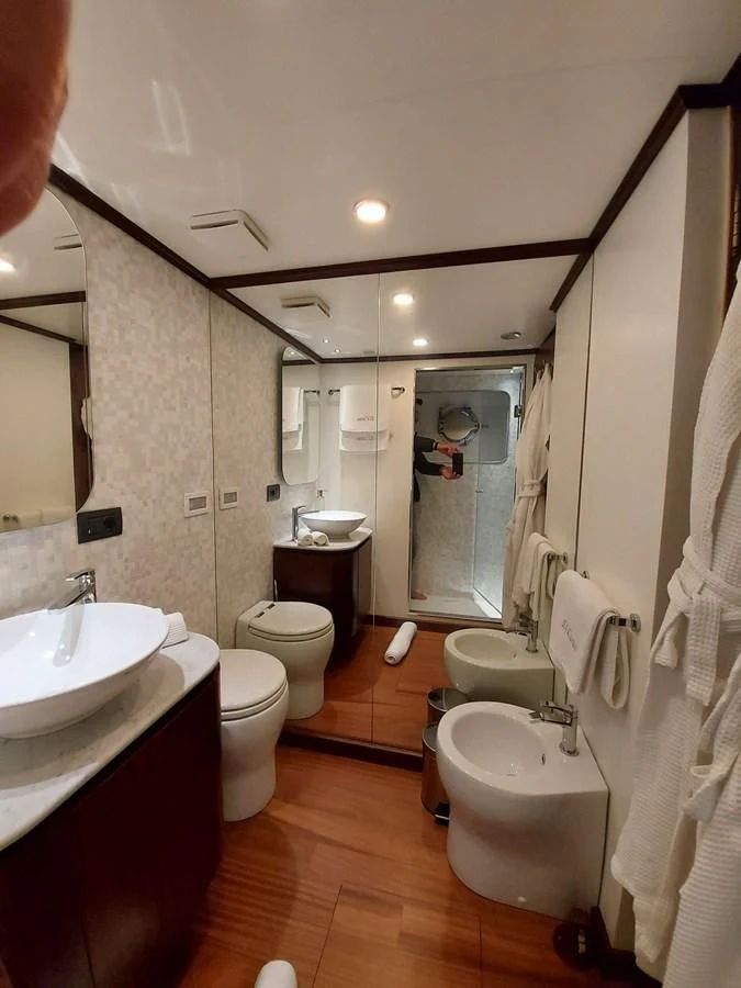 a bathroom with a sink toilet and a bathtub aboard DENEB'S DAUGHTERS Yacht for Sale