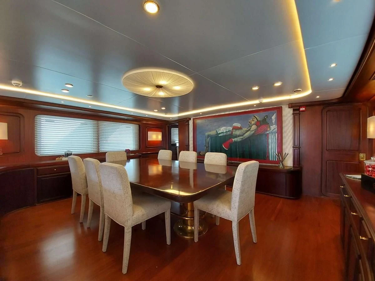 a large room with a table and chairs aboard DENEB'S DAUGHTERS Yacht for Sale