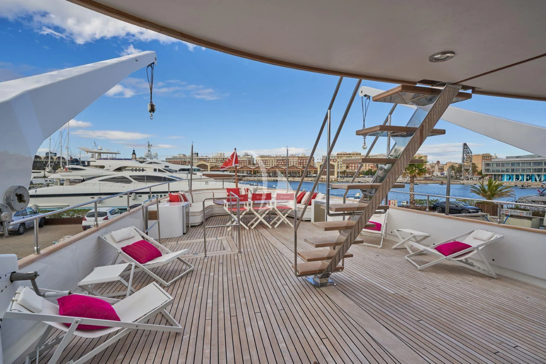 a deck with chairs and umbrellas aboard DENEB'S DAUGHTERS Yacht for Sale