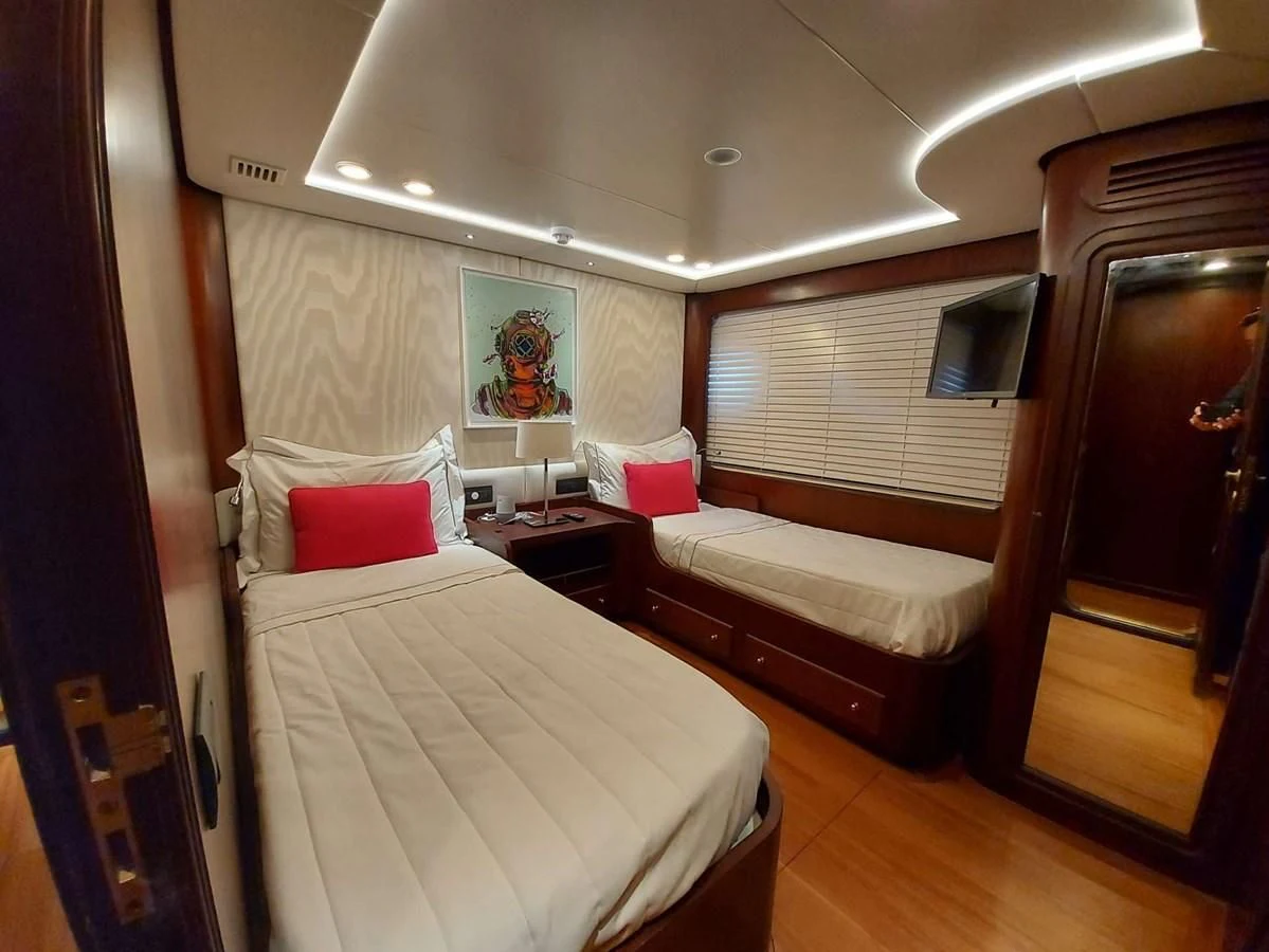 a room with two beds aboard DENEB'S DAUGHTERS Yacht for Sale