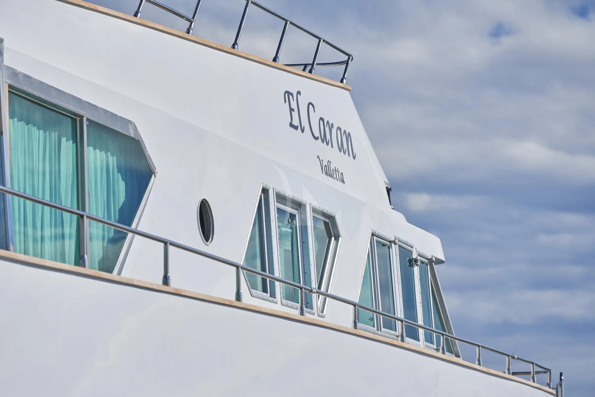 a white building with windows aboard DENEB'S DAUGHTERS Yacht for Sale