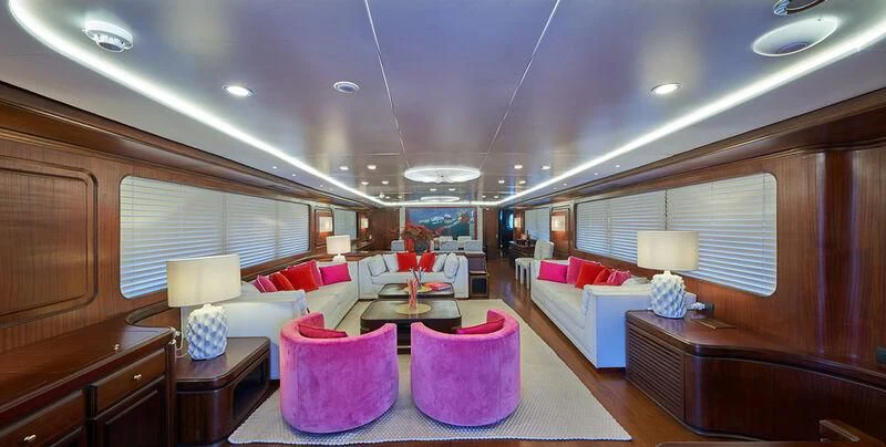 a room with a couch and a table and chairs aboard DENEB'S DAUGHTERS Yacht for Sale
