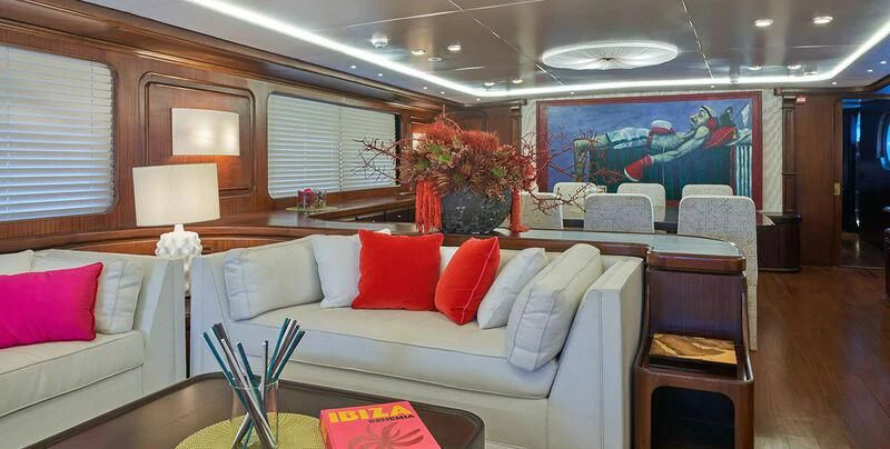 a living room with a couch and a table aboard DENEB'S DAUGHTERS Yacht for Sale