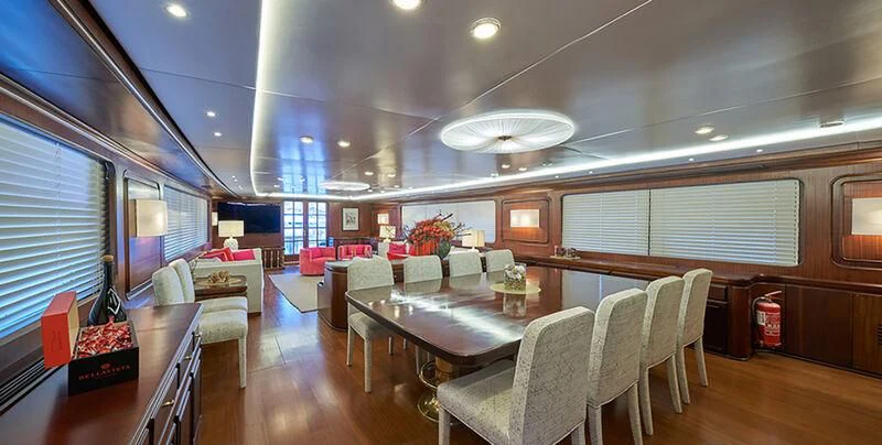 a large room with a table and chairs aboard DENEB'S DAUGHTERS Yacht for Sale