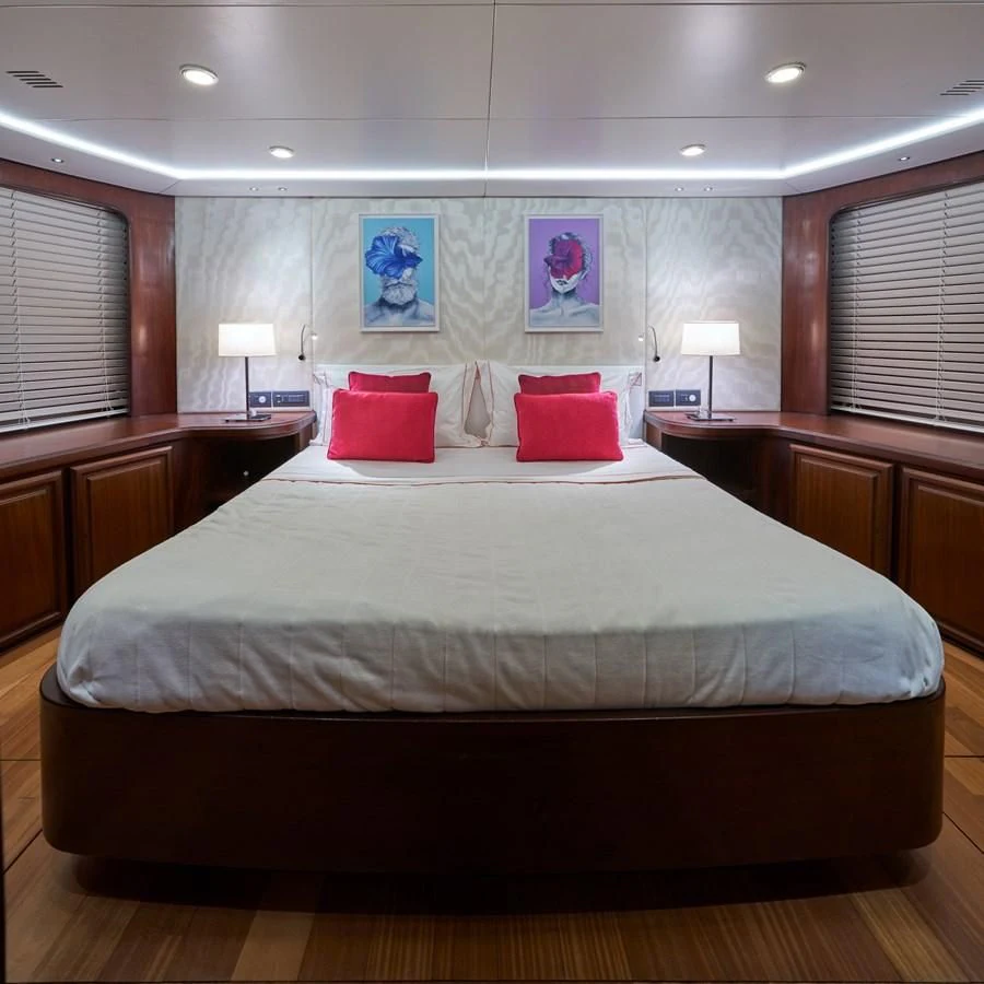 a bed with pillows on it aboard DENEB'S DAUGHTERS Yacht for Sale