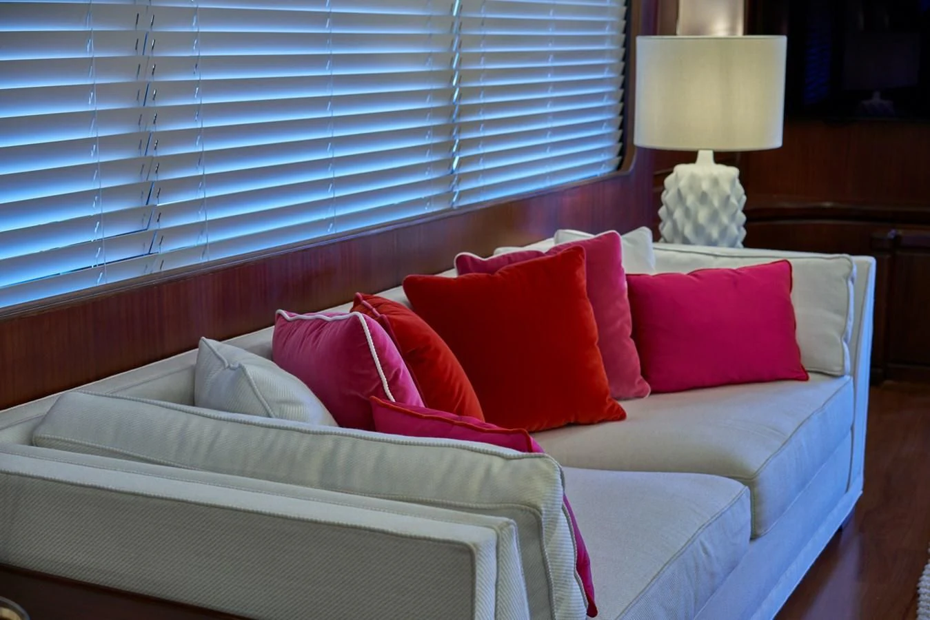 a bed with red pillows aboard DENEB'S DAUGHTERS Yacht for Sale