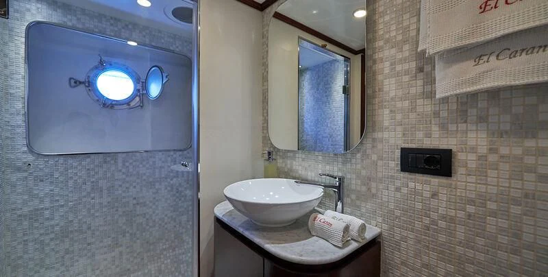 a bathroom with a sink and a mirror aboard DENEB'S DAUGHTERS Yacht for Sale