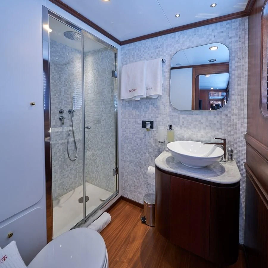 a bathroom with a sink and a shower aboard DENEB'S DAUGHTERS Yacht for Sale