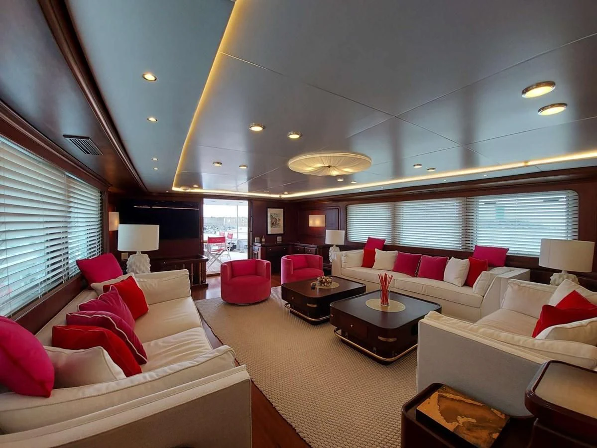 a living room with a couch and a table aboard DENEB'S DAUGHTERS Yacht for Sale