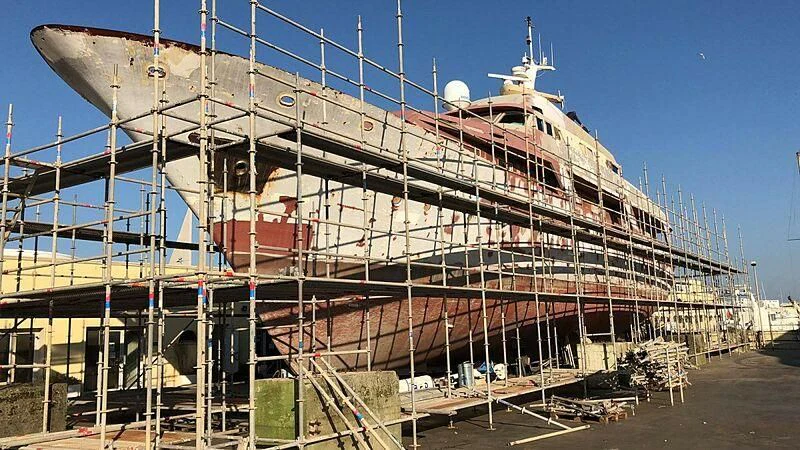 a large ship in a dock aboard DENEB'S DAUGHTERS Yacht for Sale