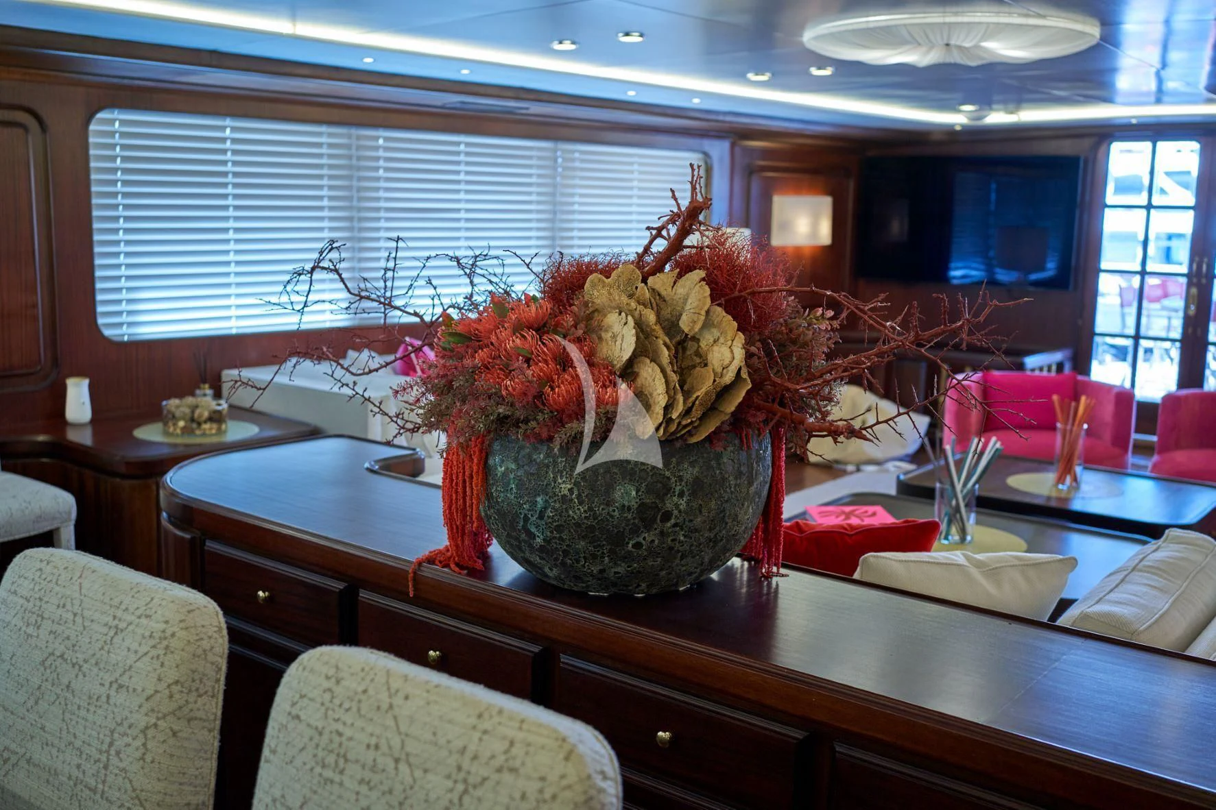a vase of flowers on a table aboard DENEB'S DAUGHTERS Yacht for Sale
