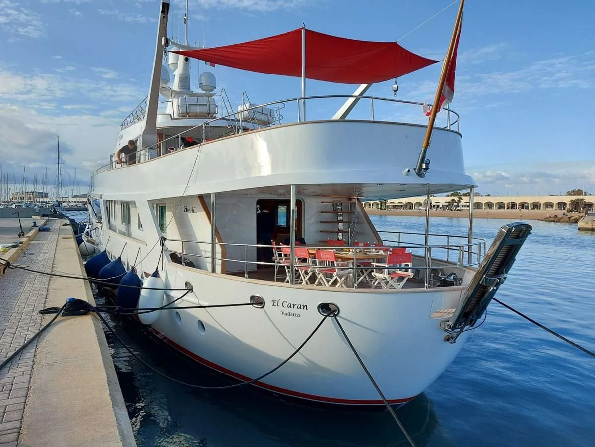 a boat with a red canopy aboard DENEB'S DAUGHTERS Yacht for Sale