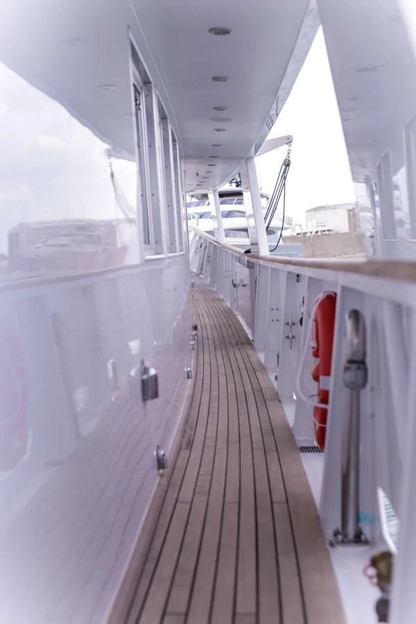 a long hallway with white walls aboard DENEB'S DAUGHTERS Yacht for Sale