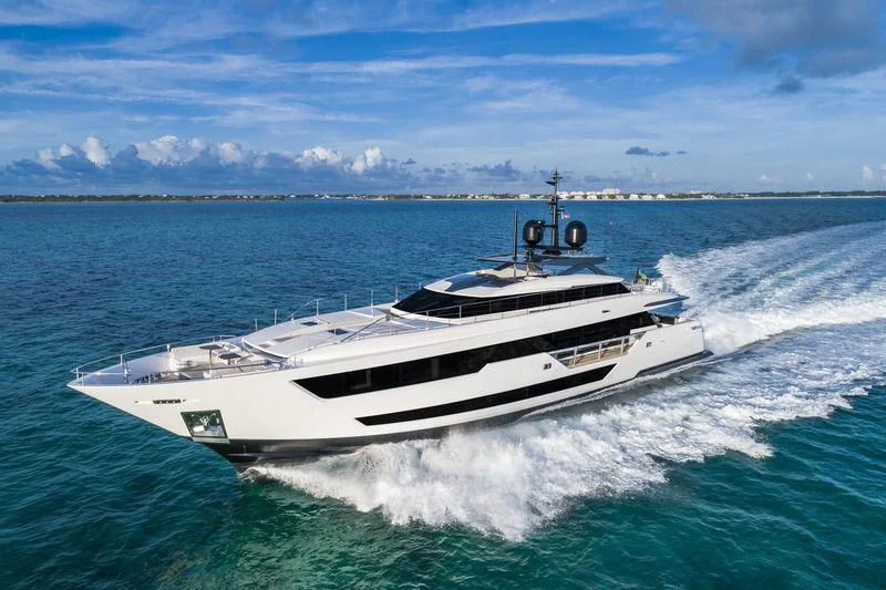 a white yacht on the water aboard NEVER BLUE Yacht for Sale