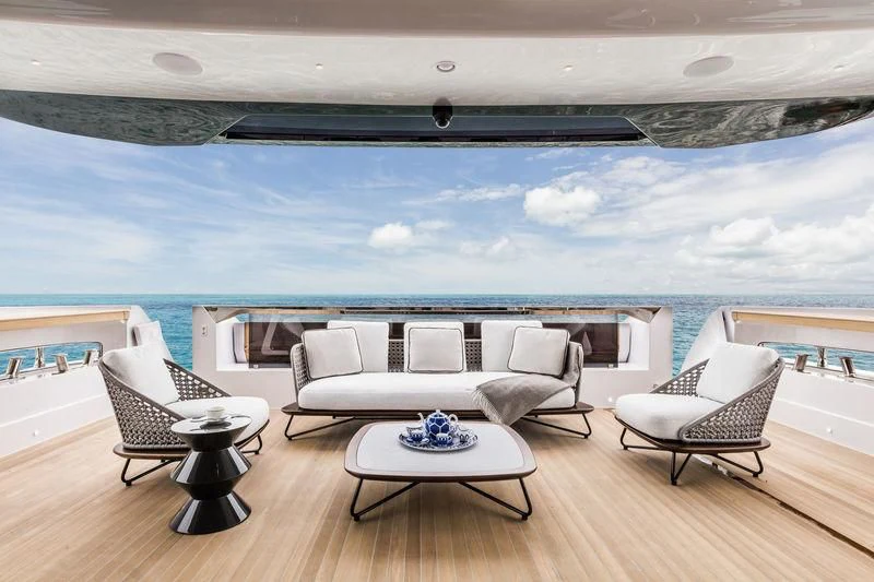 a room with a couch and a table and chairs aboard NEVER BLUE Yacht for Sale