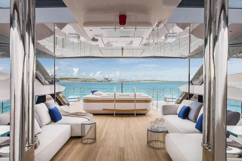 a room with a view of the ocean and a large pool aboard NEVER BLUE Yacht for Sale