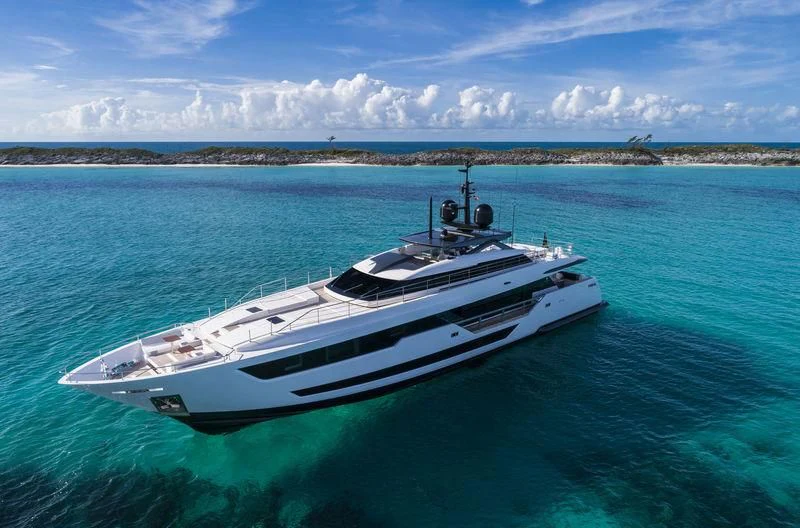 a white yacht in the water aboard NEVER BLUE Yacht for Sale